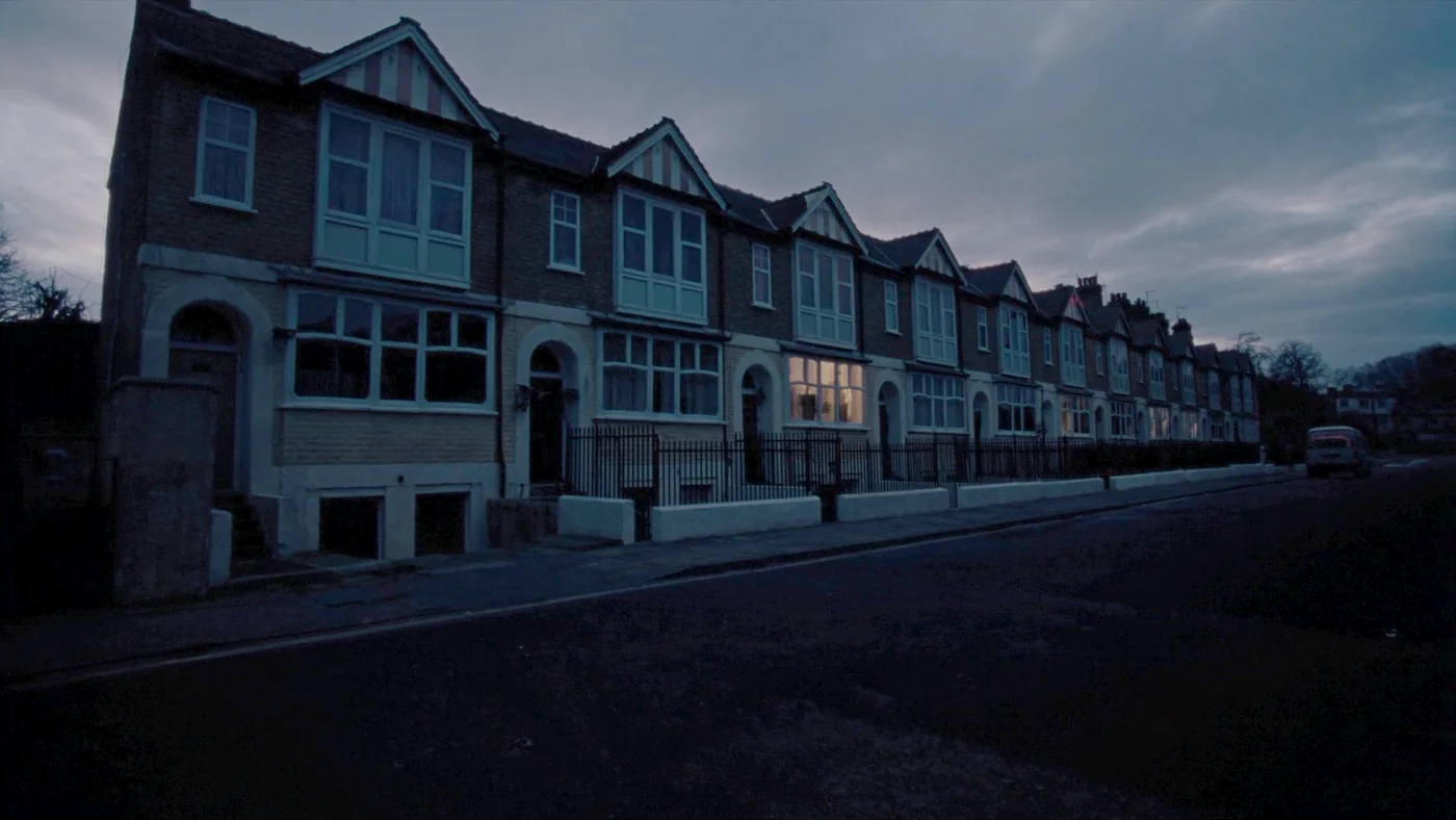 A retrofitted Victorian terrace with new triple glazing at dusk
